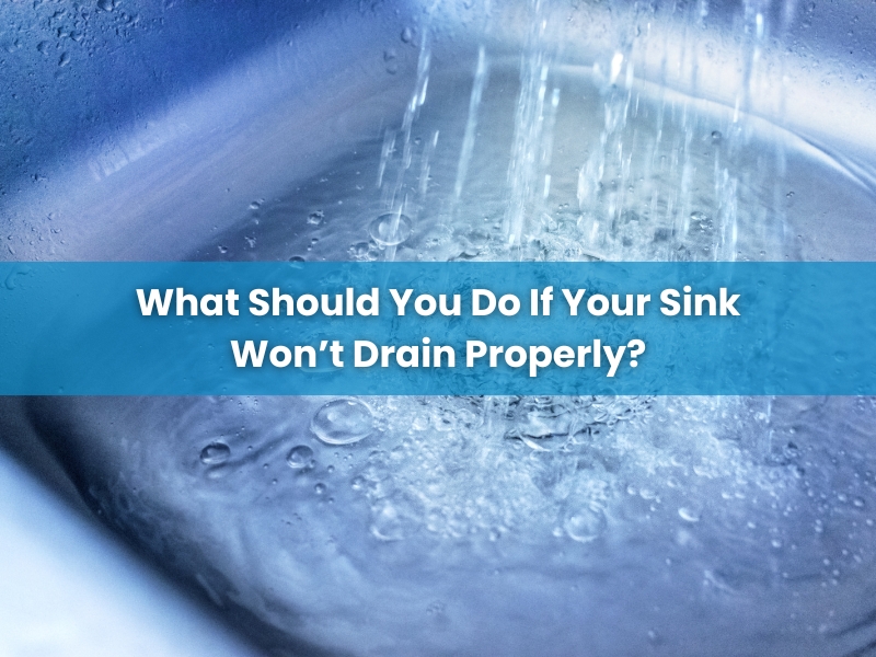 Running water over a clogged sink with text overlay asking 'What should you do if your sink won't drain?