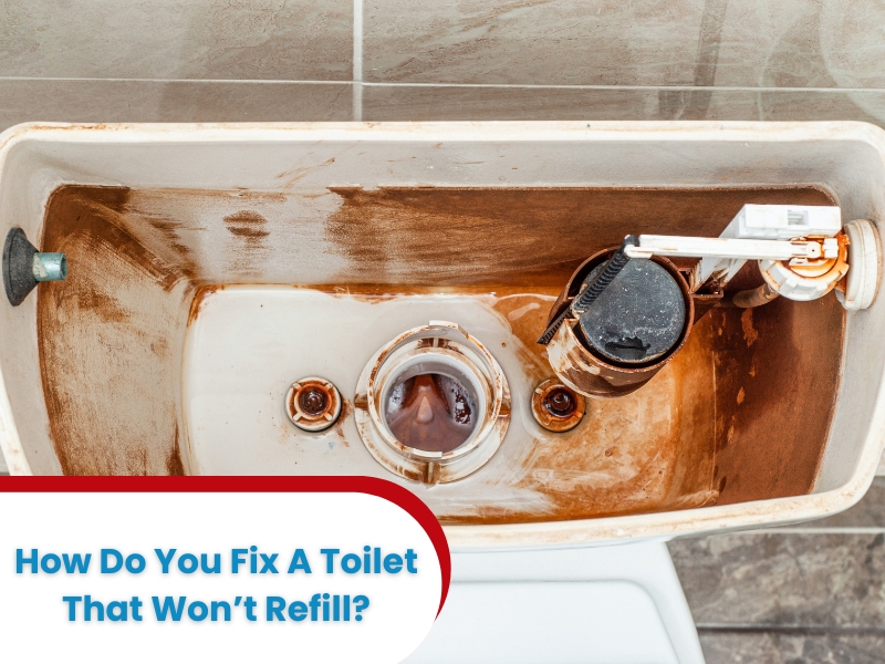 An old, dirty toilet tank showing damaged components and explaining how to fix a toilet that won't refill.