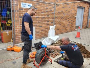 Plumbers using drain inspection equipment. Are flushable wipes actually flushable, or do they cause blockages?