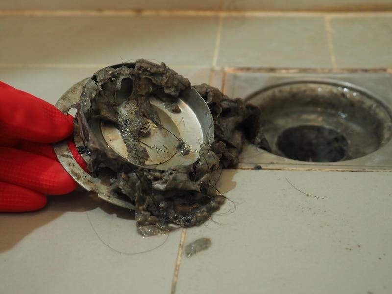 Severe clog removed during bathroom drain cleaning process.