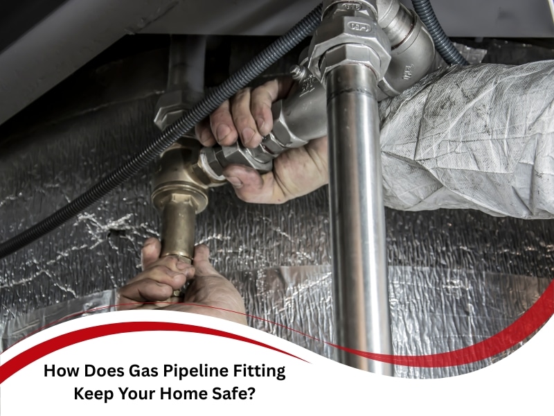 Technician tightening gas pipeline fitting connection under metal pipes for safety.