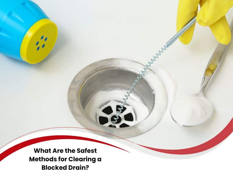 Using baking soda and drain snake for clearing a blocked drain.