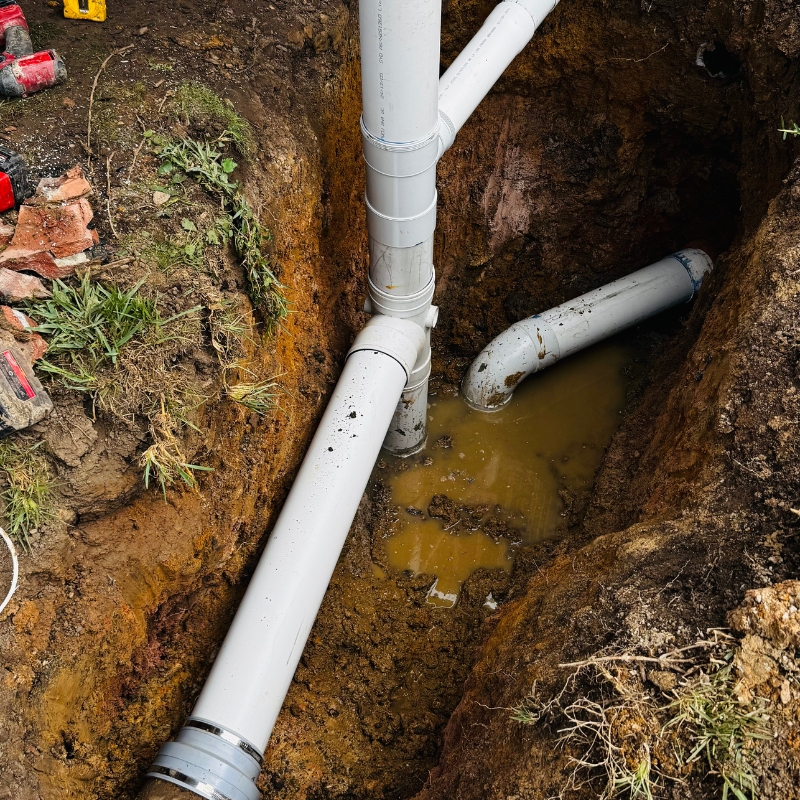 High-pressure water jet clearing stubborn drain blockages