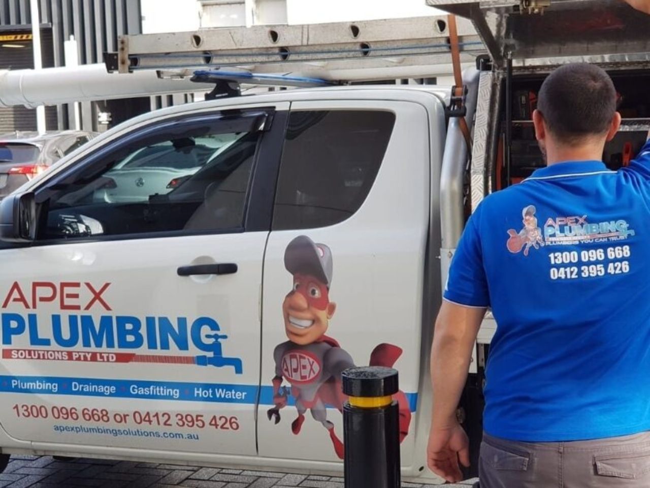 Apex plumber and branded van in a Sydney suburb